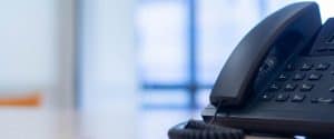 Image of an office telephone with background blur